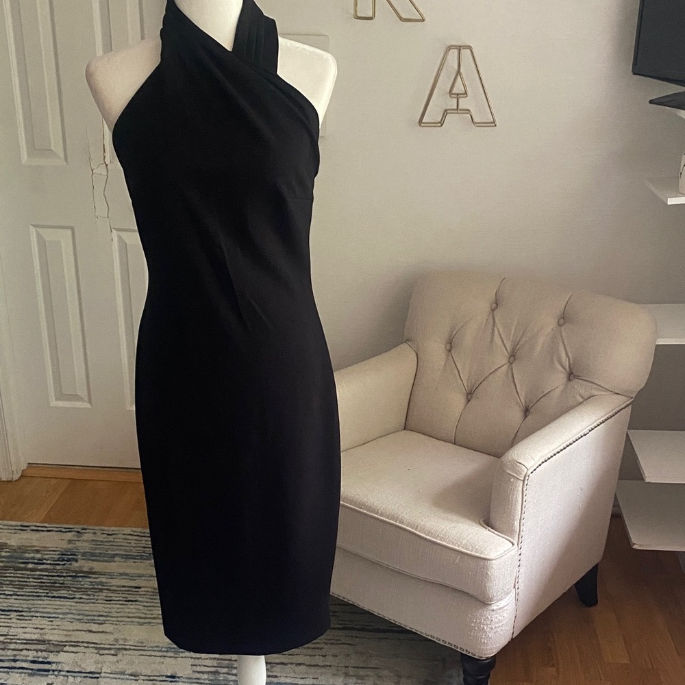 Rachel Roy form fitting black dress.